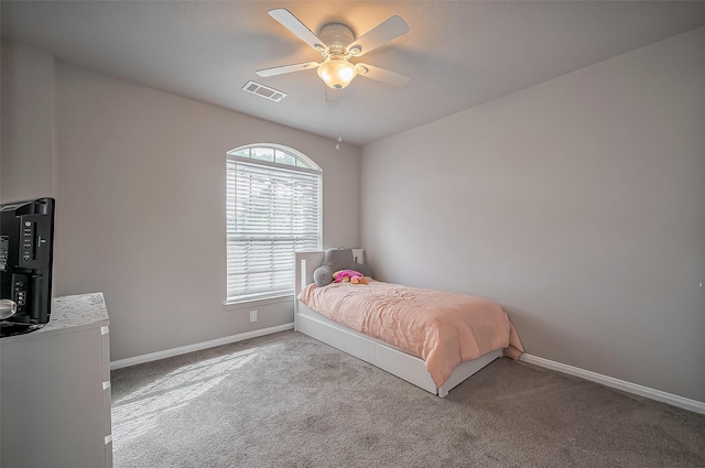 bedroom with ceiling fan, carpet, visible vents, and baseboards