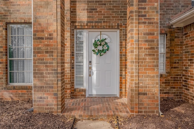 entrance to property with brick siding