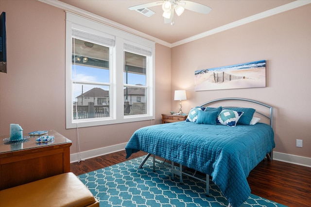 172 Ocean View Dr, Crystal Beach, TX 77650 - bedroom with crown molding, wood finished floors, and ceiling fan