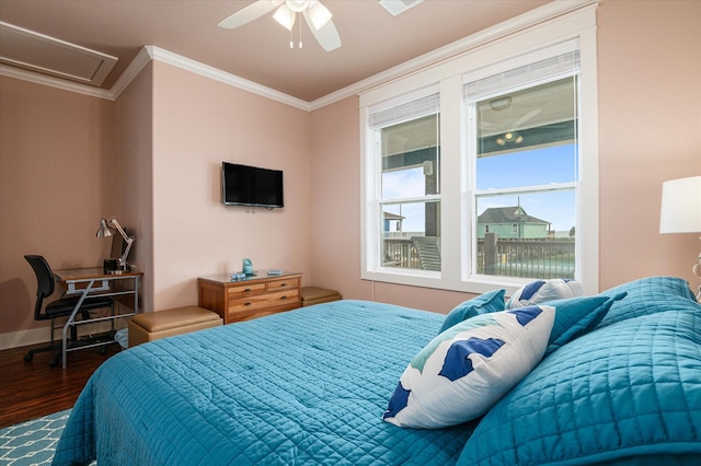 172 Ocean View Dr, Crystal Beach, TX 77650 - bedroom with dark wood-type flooring, ornamental molding, and a ceiling fan