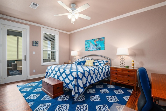 172 Ocean View Dr, Crystal Beach, TX 77650 - bedroom featuring ornamental molding, wood finished floors, a ceiling fan, a desk, and access to exterior