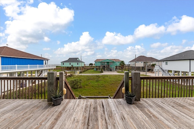 172 Ocean View Dr, Crystal Beach, TX 77650 - wooden deck with a lawn and a residential view