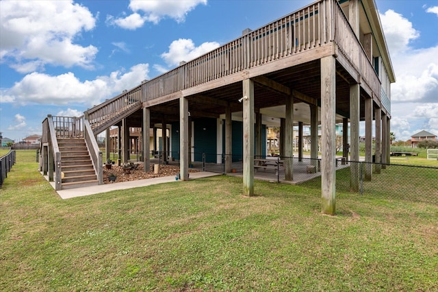 172 Ocean View Dr, Crystal Beach, TX 77650 - back of property featuring stairway and a wooden deck