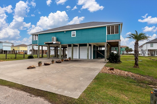 172 Ocean View Dr, Crystal Beach, TX 77650 - coastal home with a carport, concrete driveway, a front yard, and a residential view