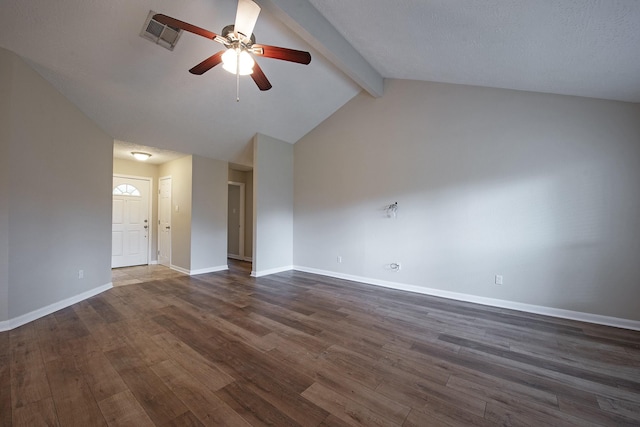 unfurnished room featuring dark wood-type flooring, lofted ceiling with beams, visible vents, and baseboards