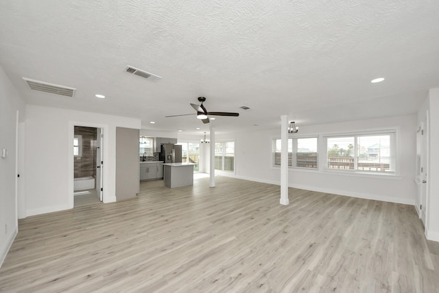 unfurnished living room featuring recessed lighting, visible vents, and light wood finished floors