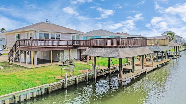 dock area with boat lift, stairway, a patio, and a yard