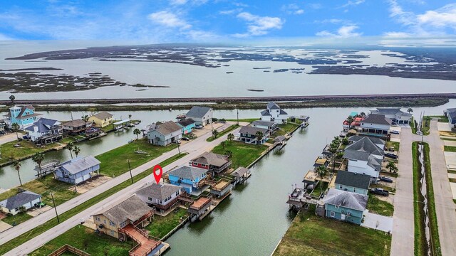 aerial view featuring a water view and a residential view