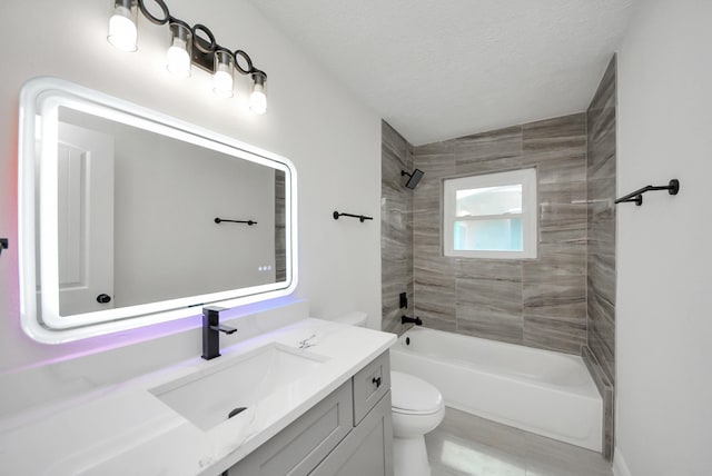 bathroom featuring toilet, shower / bath combination, a textured ceiling, and vanity