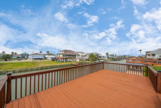 deck with a water view and a residential view