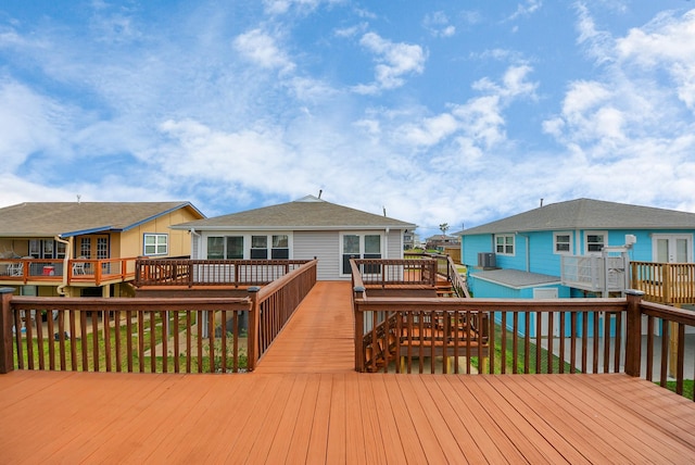 wooden deck featuring a residential view