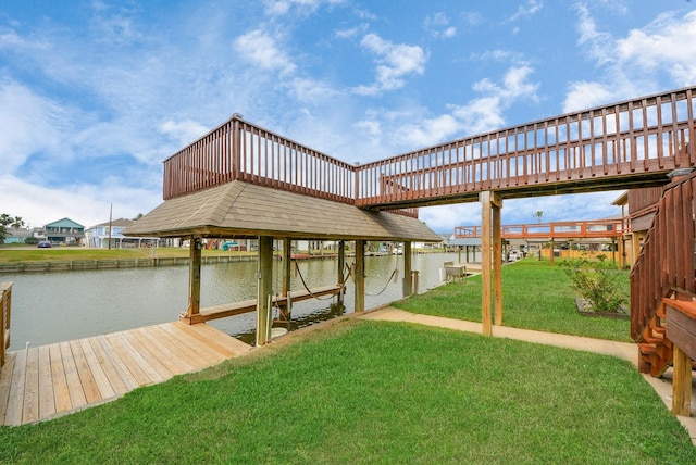 view of dock with a yard, a water view, and boat lift