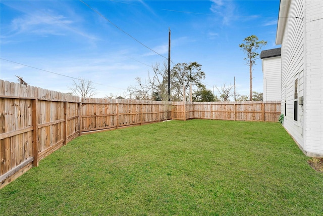 view of yard featuring a fenced backyard