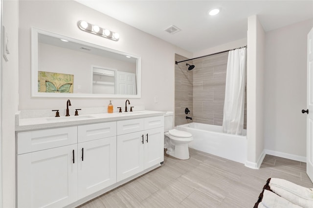 bathroom with double vanity, visible vents, a sink, and shower / tub combo with curtain