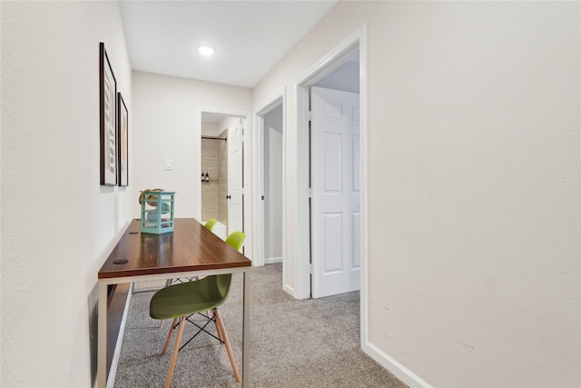 hall with carpet and baseboards