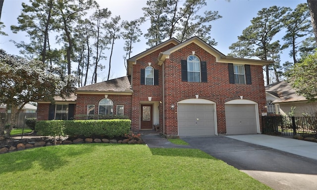 colonial inspired home featuring a front yard, brick siding, fence, and driveway