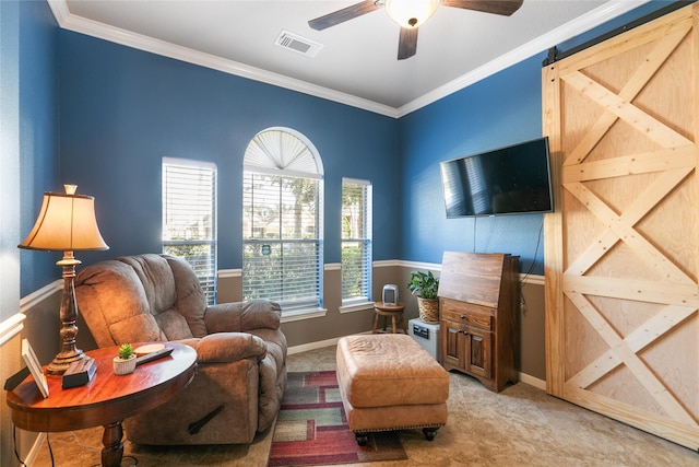 living area with ornamental molding, visible vents, carpet floors, and a barn door