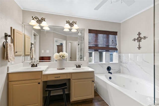 bathroom featuring crown molding, a sink, double vanity, a whirlpool tub, and a ceiling fan