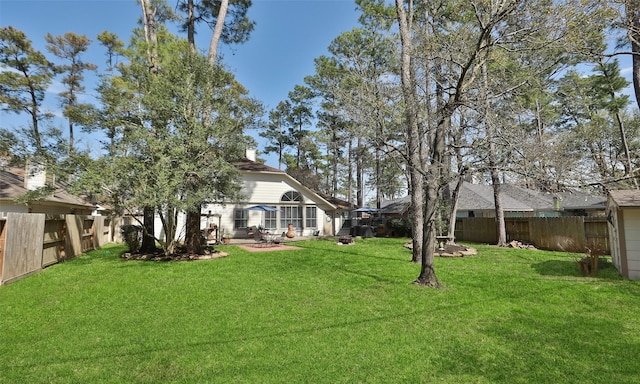 view of yard with a patio and a fenced backyard