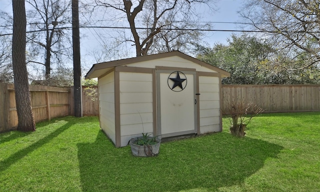 view of shed featuring a fenced backyard