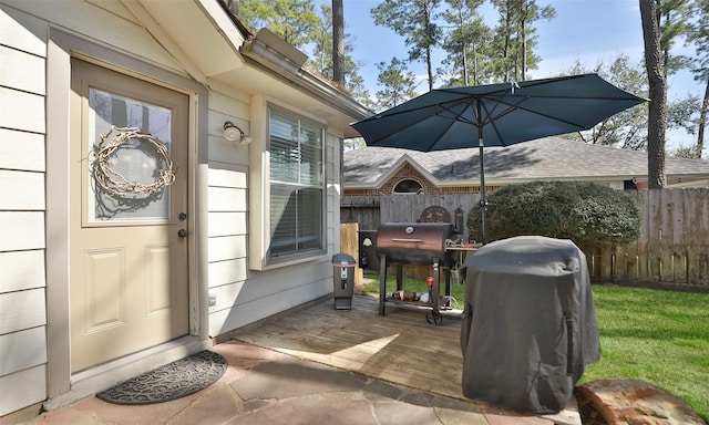 view of exterior entry with fence