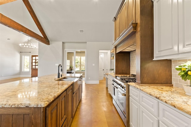 kitchen with range with two ovens, visible vents, backsplash, lofted ceiling with beams, and white cabinets