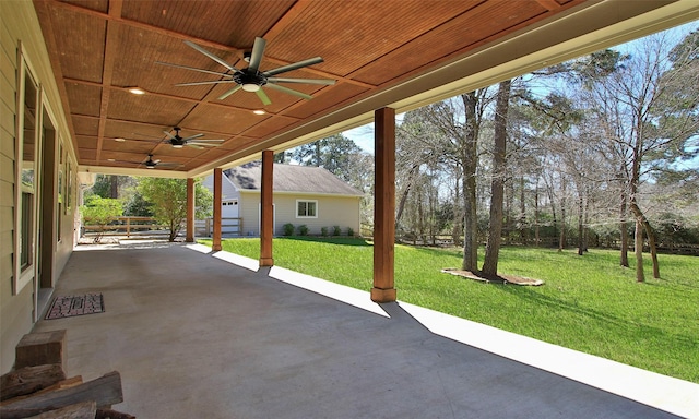 view of patio / terrace with ceiling fan and an outdoor structure