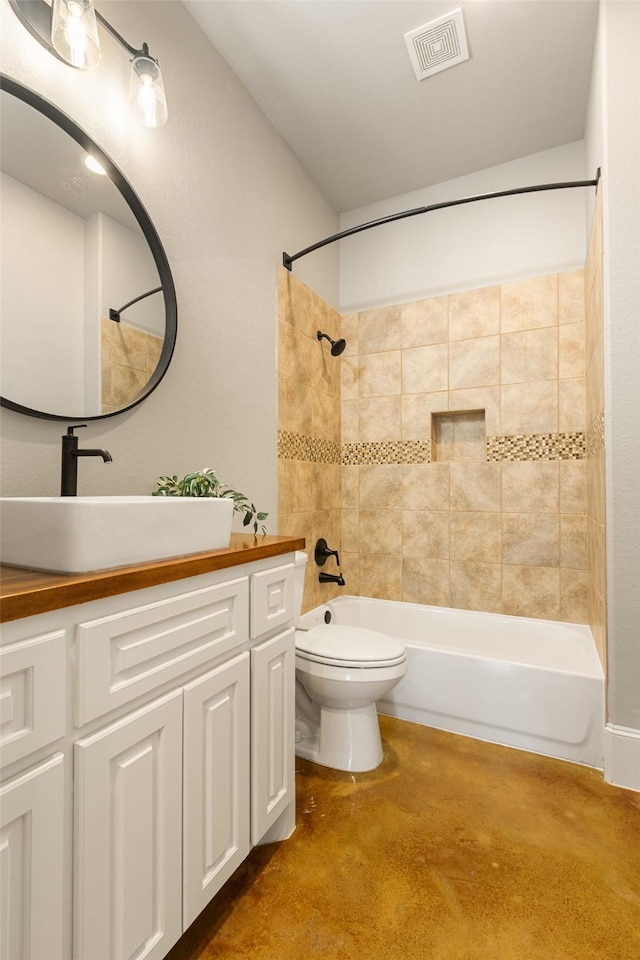 bathroom featuring visible vents, shower / bath combination, vanity, and toilet