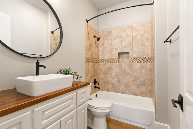 bathroom featuring shower / washtub combination, vanity, and toilet