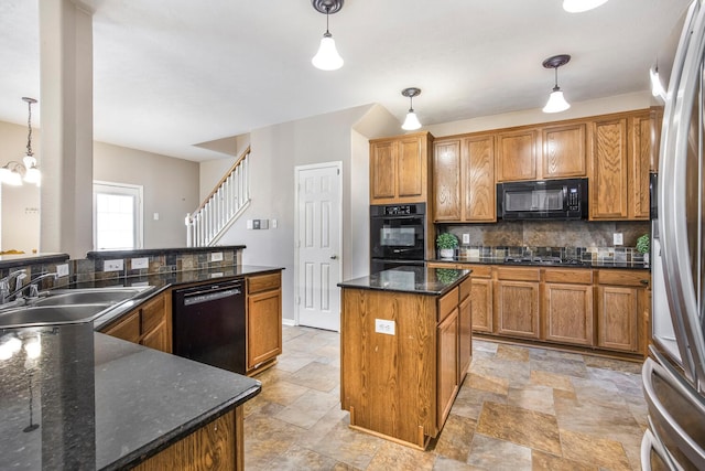 kitchen with brown cabinetry, backsplash, black appliances, and a center island