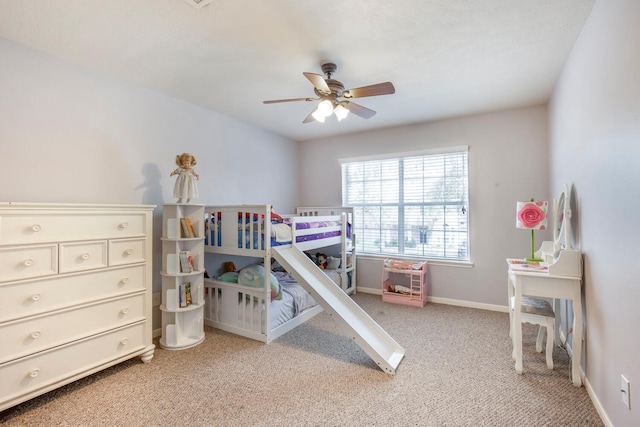 bedroom featuring light carpet, ceiling fan, and baseboards