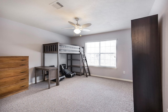 bedroom featuring baseboards, visible vents, carpet floors, and ceiling fan