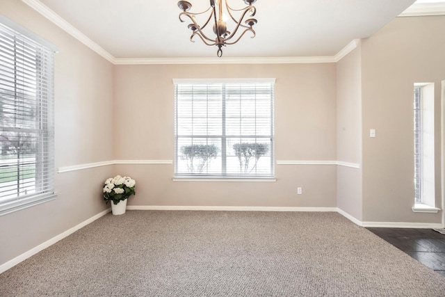 unfurnished room with a notable chandelier, a healthy amount of sunlight, and ornamental molding