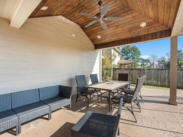 view of patio / terrace with an outdoor living space, outdoor dining area, fence, and a ceiling fan