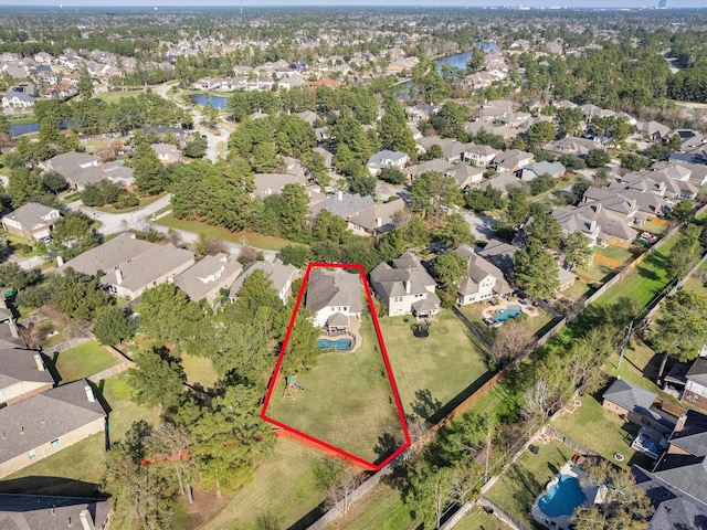 aerial view with a water view and a residential view