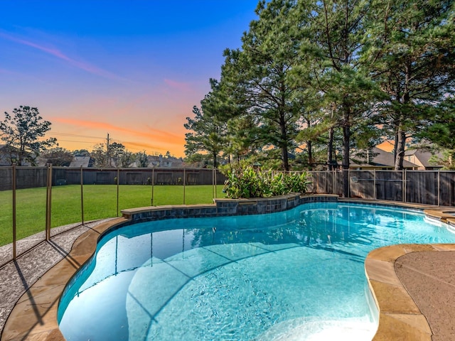 view of swimming pool featuring a yard, a fenced backyard, and a fenced in pool