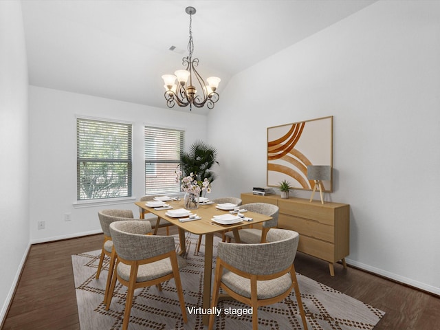 dining room with visible vents, baseboards, dark wood finished floors, lofted ceiling, and an inviting chandelier