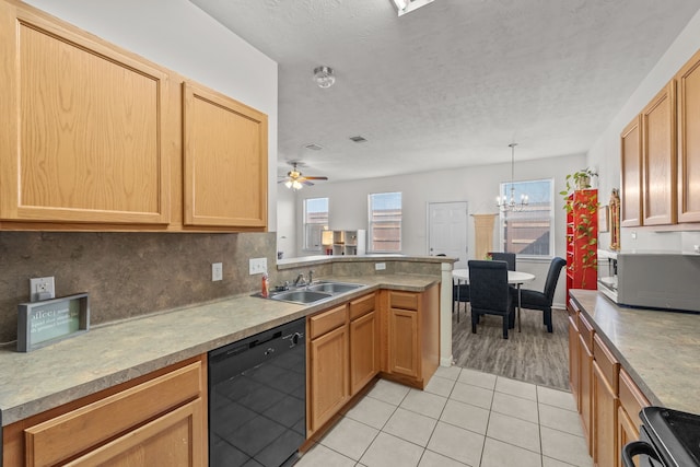 kitchen with black dishwasher, plenty of natural light, white microwave, a sink, and range