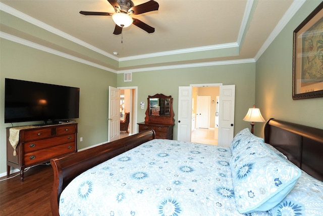 bedroom featuring baseboards, visible vents, ceiling fan, ornamental molding, and wood finished floors