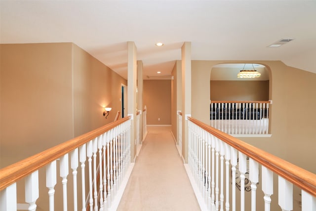 hall featuring recessed lighting, visible vents, baseboards, and light colored carpet