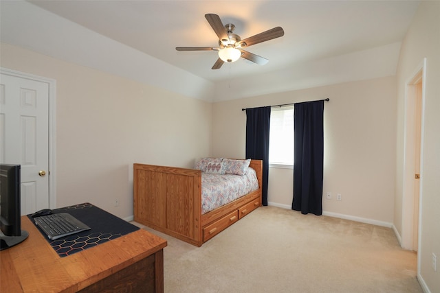 bedroom with light carpet, ceiling fan, lofted ceiling, and baseboards