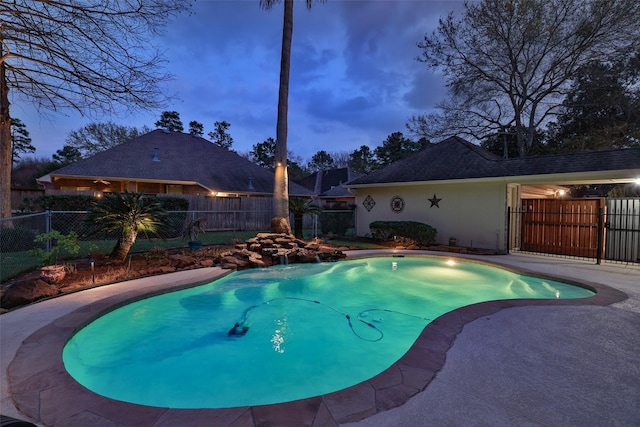 view of pool with a fenced backyard