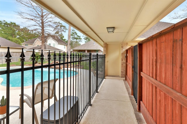 view of swimming pool with a fenced in pool