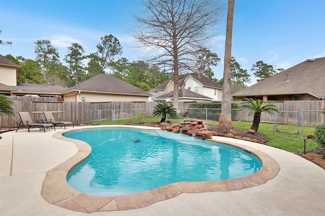 view of swimming pool featuring a fenced in pool, a patio area, and a fenced backyard