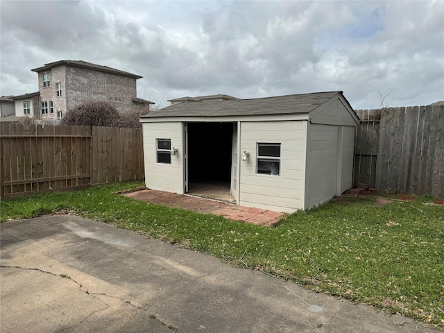 view of shed with a fenced backyard