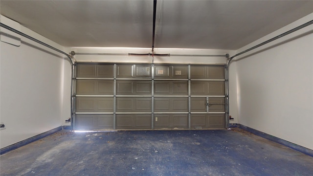 garage featuring baseboards