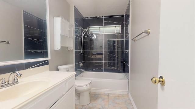 bathroom featuring vanity, tile patterned floors, toilet, and washtub / shower combination