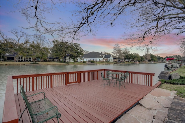 dock area featuring a deck with water view