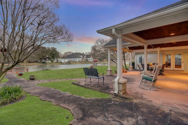 view of patio with a water view