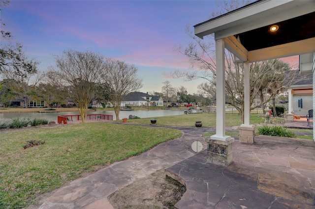 view of patio with a water view